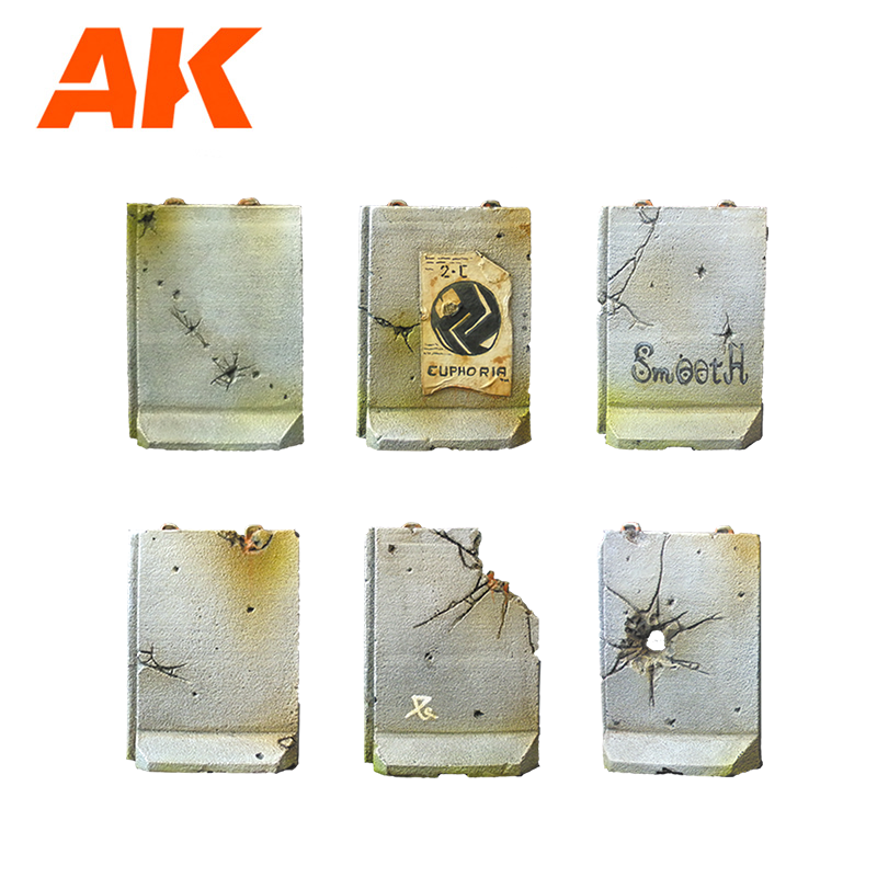 Six miniature concrete barriers, heavily weathered with cracks, bullet holes, a poster, and graffiti. AK product
