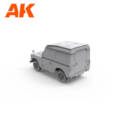 An unpainted grey model of a classic Land Rover Series 4x4 -  viewed from the rear on white