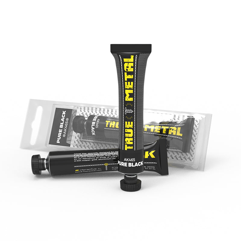 Three black tubes of AK True Metal Pure Black metallic modeling wax- One stands -  one lies -  one in blister pack