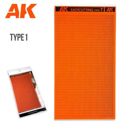 AK Easycutting Type 1 orange cutting mat with a black grid, shown unpackaged and in its retail package