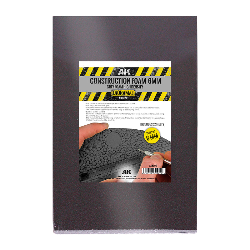 AK Construction Foam 6mm package, with hands carving cobblestones into grey foam for dioramas