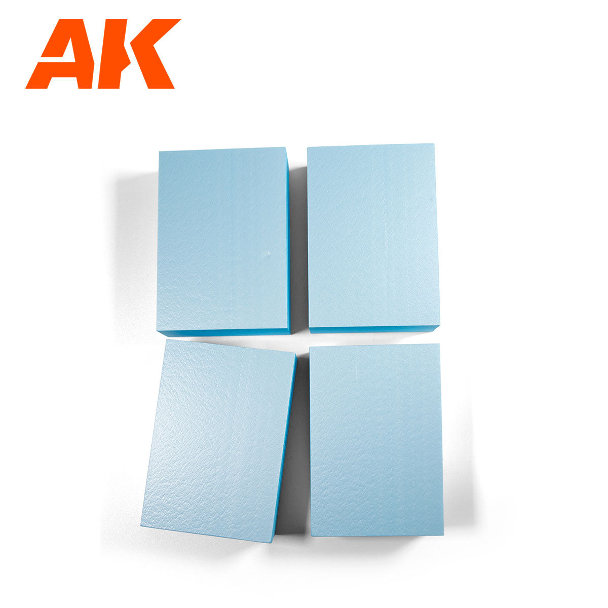 Grid of four light blue textured rectangular blocks on a white background, with the orange AK logo in the top left