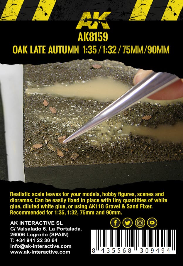 Tweezers place a miniature autumn oak leaf onto a textured diorama base with a puddle