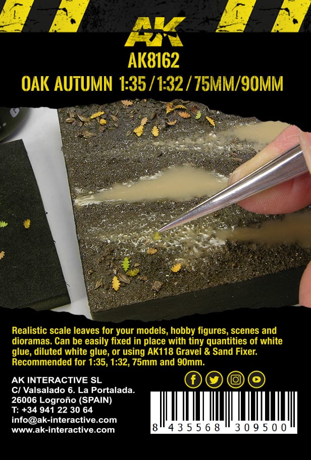 Close-up of tweezers placing a miniature autumn leaf onto a wet -  muddy diorama base with small puddles