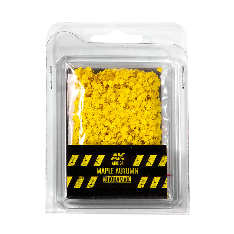 Clear plastic pack of AK Maple Autumn diorama leaves; tiny yellow leaf-shaped pieces for model scenery