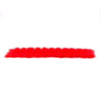 A horizontal strip of vivid red fluffy AK Interactive 4mm wargame vegetation tufts is shown against a plain white background
