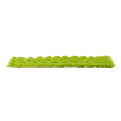 AK Interactive Vegetation Light Green Tufts 4mm, presented as a linear arrangement of numerous fluffy light green grass clumps on a clean white background