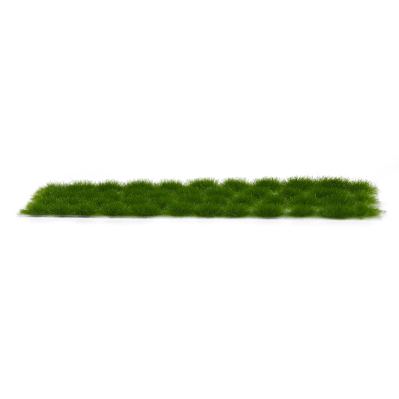 A long strip of AK Interactive dark green 4mm model vegetation tufts against a white background