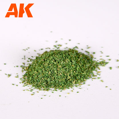 AK brand green model scenery flocking, a small pile of tiny green granules on a white background
