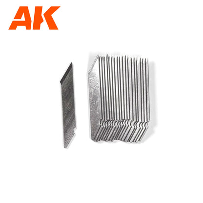 A single silver hobby knife blade next to a stack of identical blades on a white background