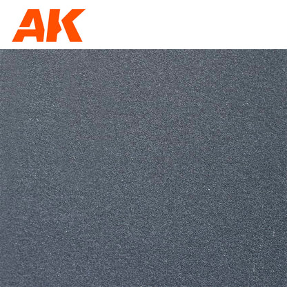 Dark grey granular sandpaper texture with orange AK logo in top left