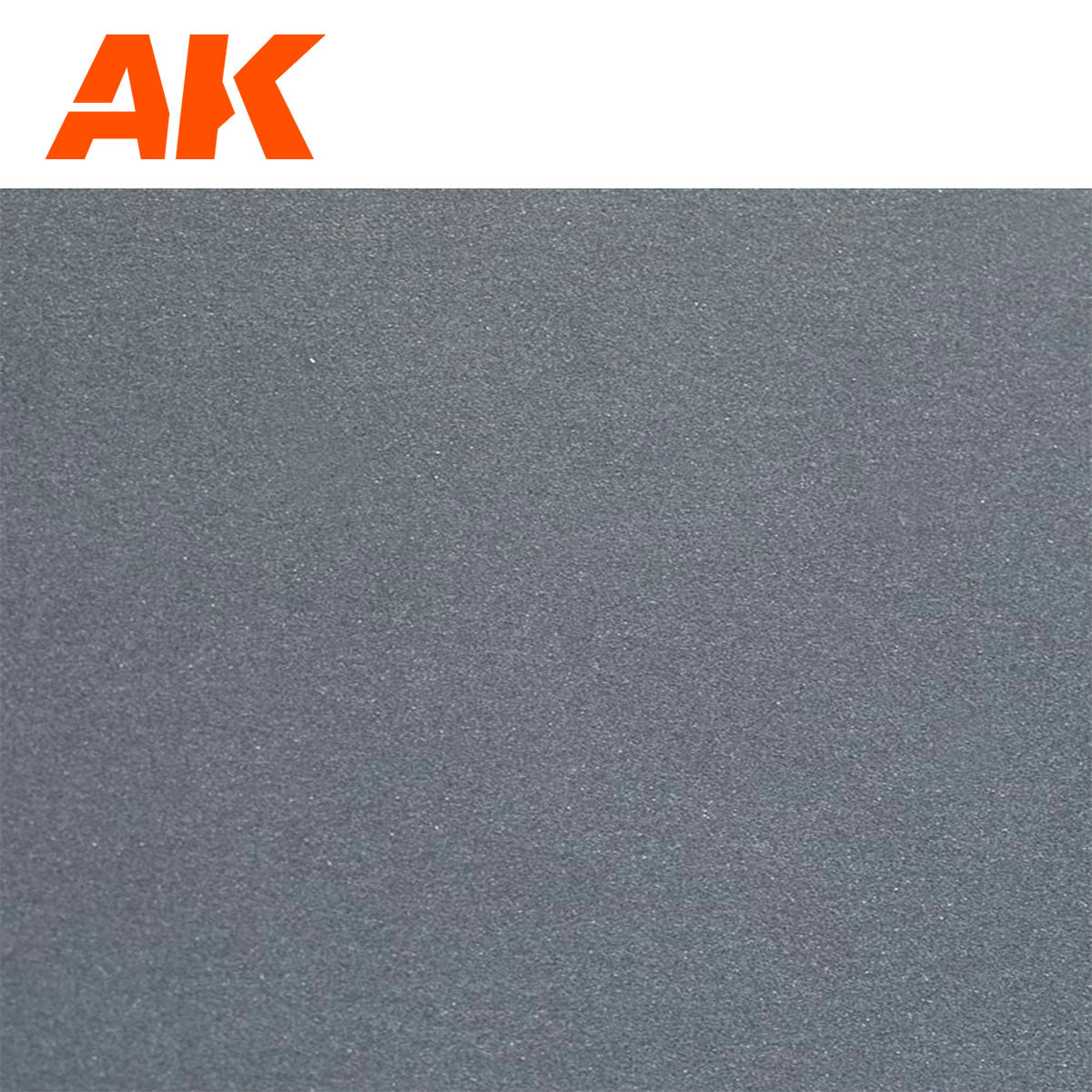 Orange AK logo above a dark gray, granular surface