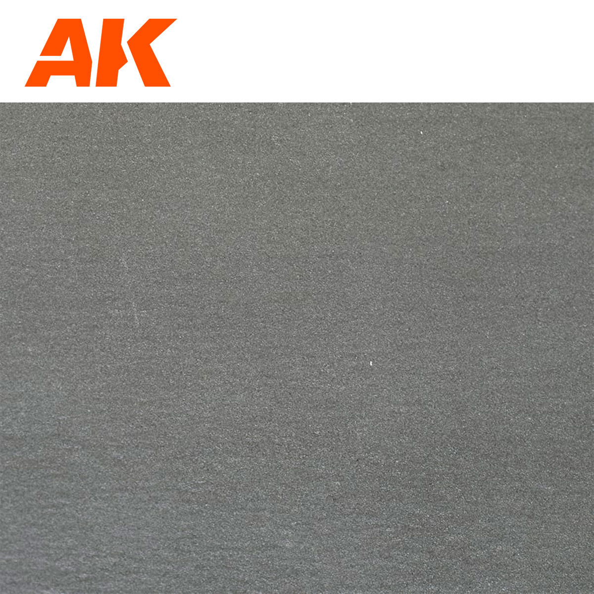 Orange AK logo above a dark gray, grainy textured surface