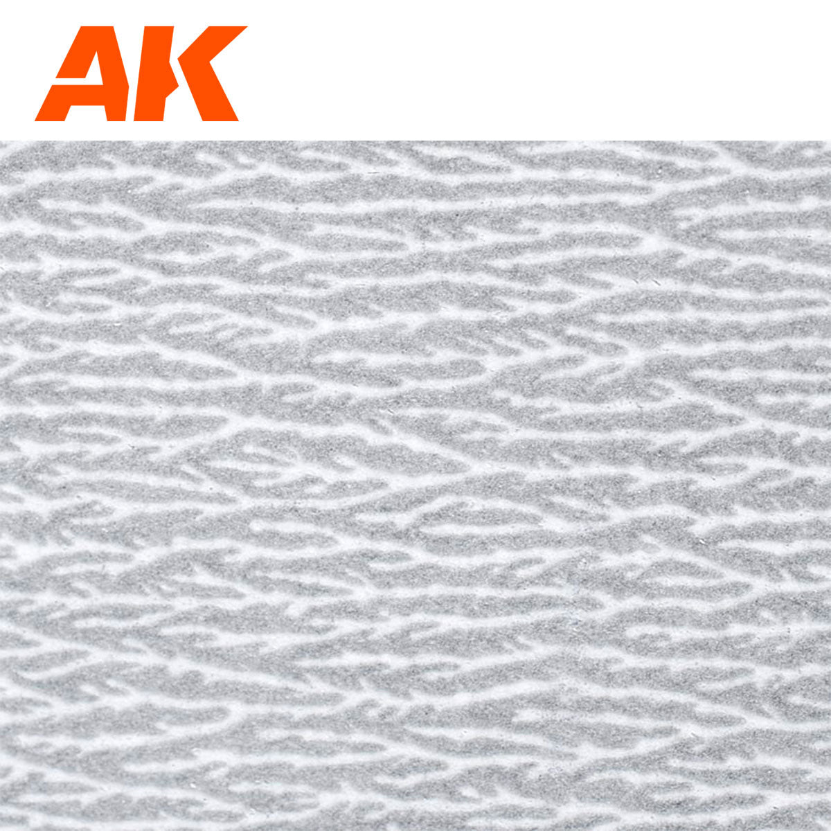 Orange AK logo above a grey and white winter camouflage pattern