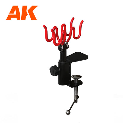 AK Airbrush holder: Black stand with a red four-position holder, desk-mounted via C-clamp