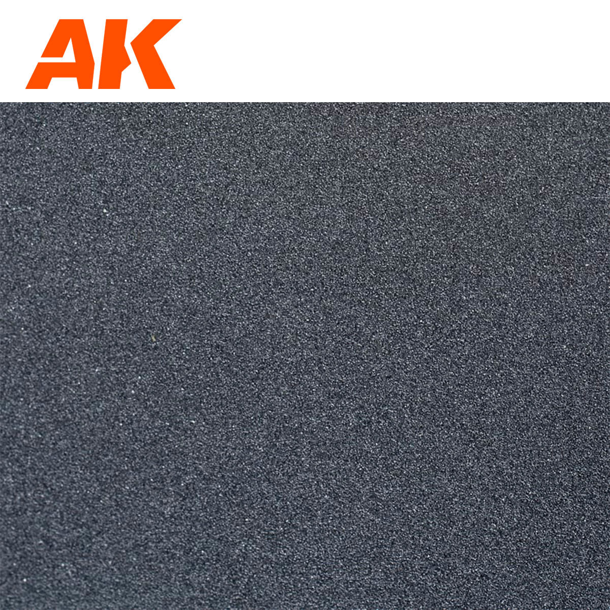 AK Interactive logo above a close-up of dark gray sandpaper, fine-grain texture, resembling modeling sand or grit