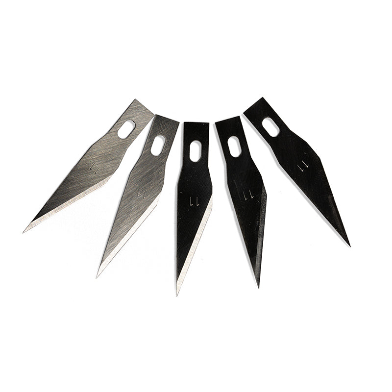 Five sharp No. 11 precision knife blades -  two silver and three black -  fanned out on a white background