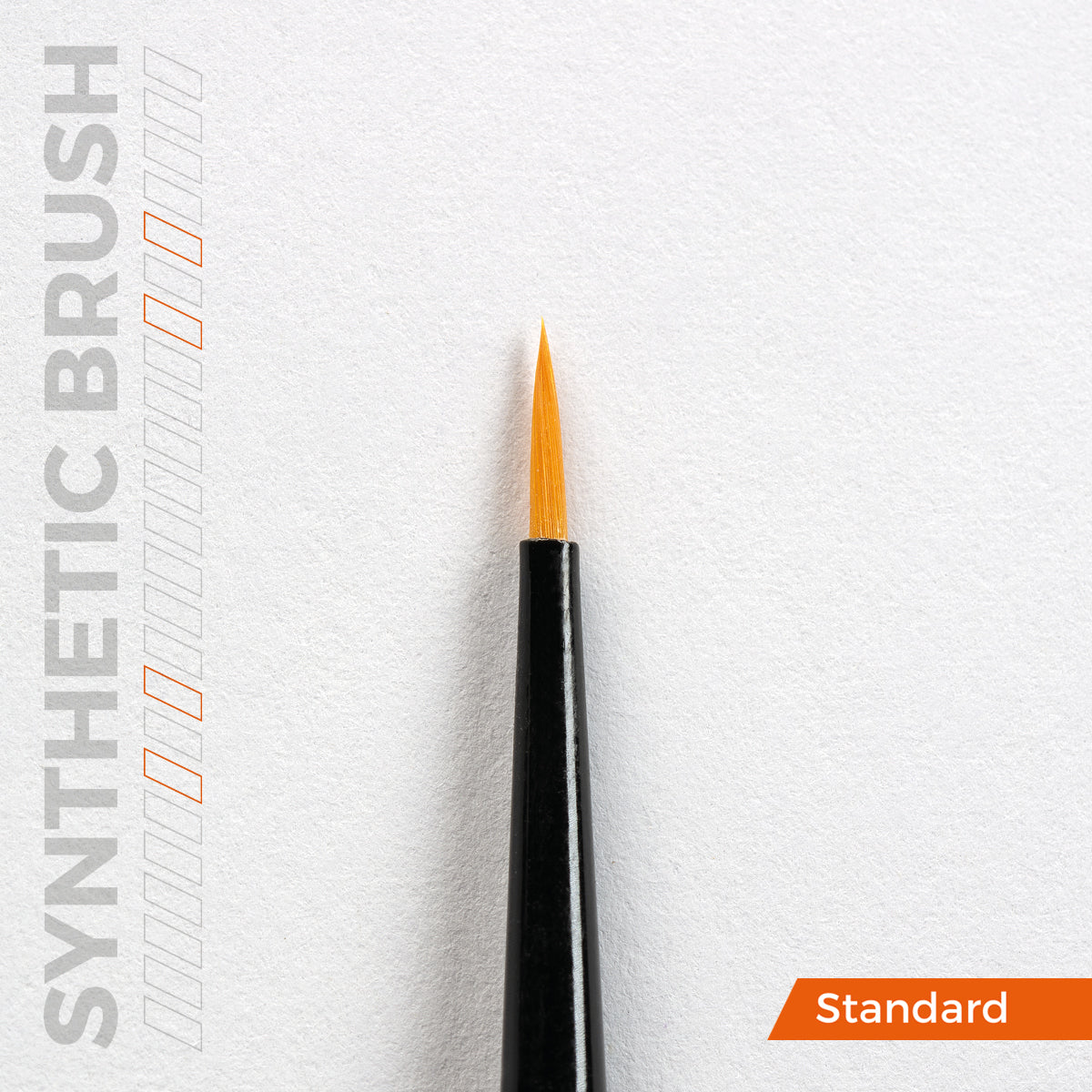 A close-up of a synthetic precision brush with a fine orange tip and black handle on a white background, with SYNTHETIC BRUSH text and a Standard label