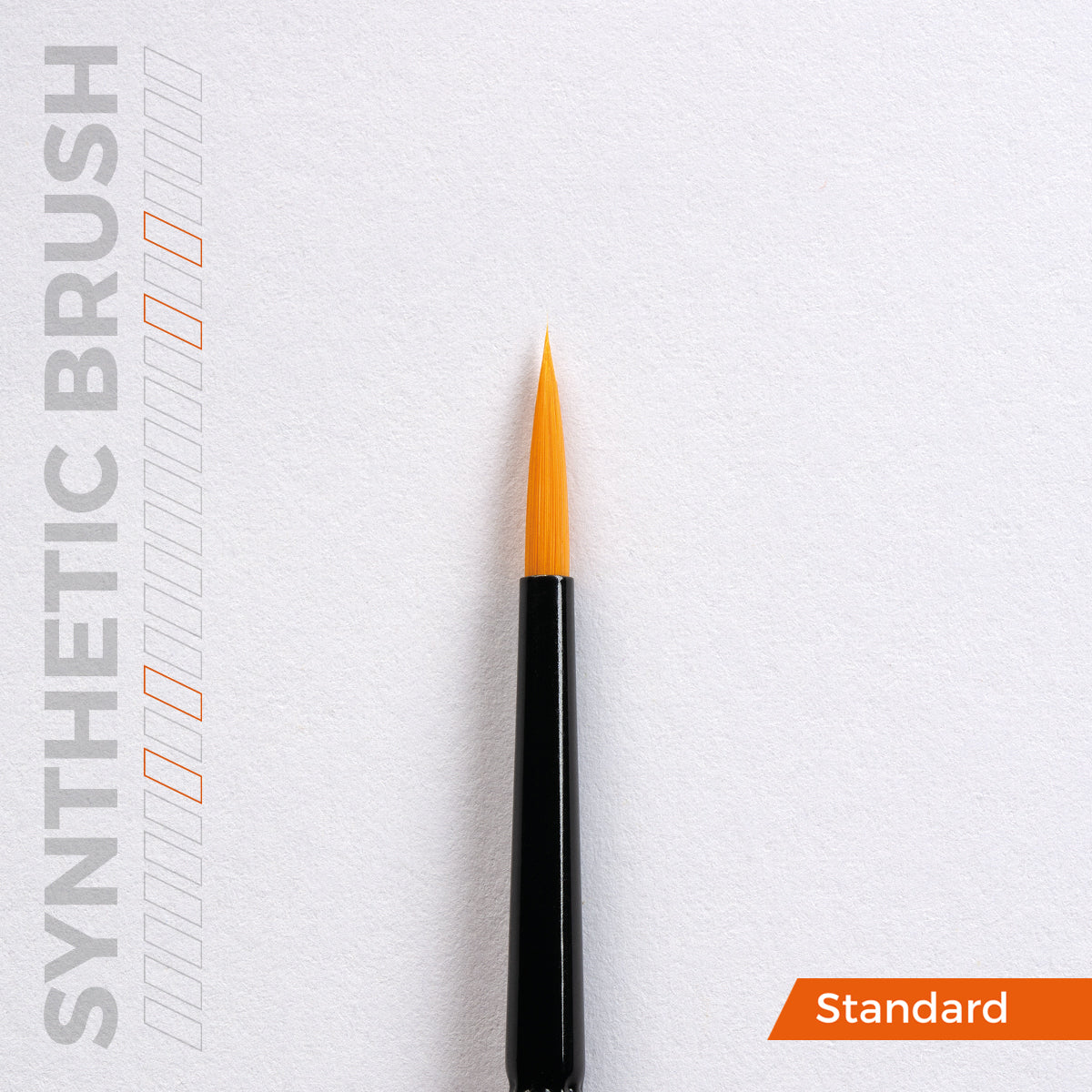 Close-up of a pointed synthetic paintbrush with orange bristles, black handle. Text: 'SYNTHETIC BRUSH' and 'Standard'