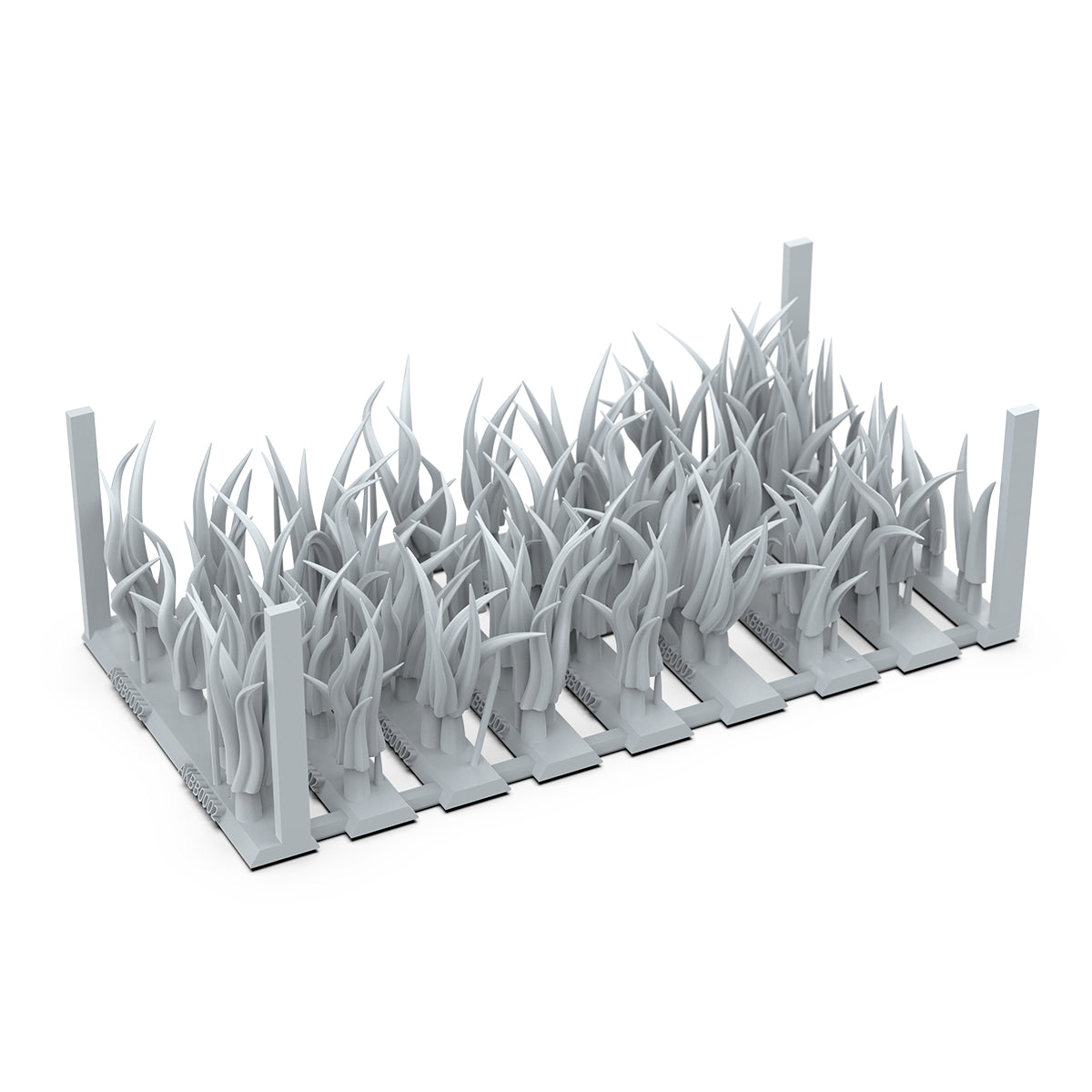 Gray unpainted model kit pieces of tall, dense wild grass clumps attached to bases for miniature dioramas
