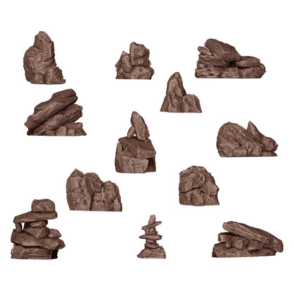 Eleven brown 3D rock formations and stacked stone cairns, isolated on a white background
