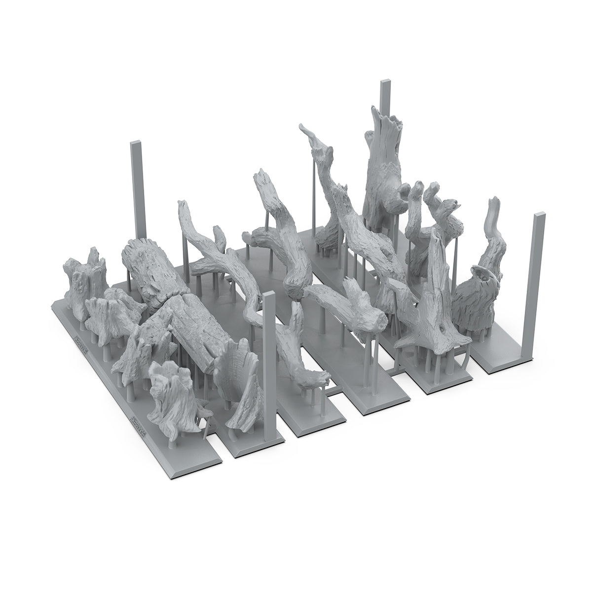 Gray miniature logs and driftwood terrain models attached to 3D printing supports on a rectangular base