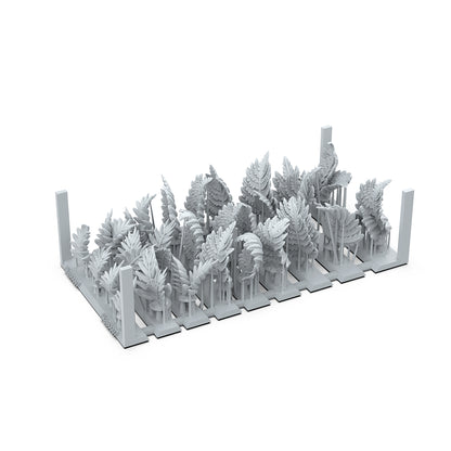 Gray miniature ferns and jungle plants on a base, ready for modeling or diorama assembly
