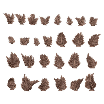 Thirty brown miniature fern and foliage sculpts arranged in rows