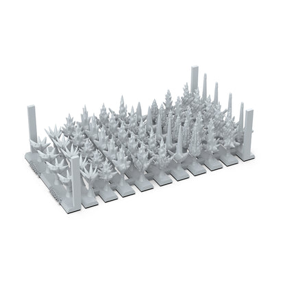 grey 3D printed miniature sprue with various stylized spikey trees and sci-fi plant terrain elements for tabletop gaming