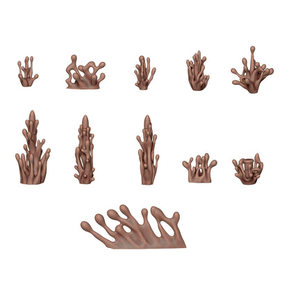 11 brown 3D models of abstract organic shapes resembling coral, fluid splatters, or dripping mud effects on a white background
