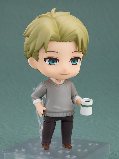 Chibi Loid Forger with blond hair, blue eyes, grey sweater, smiling and holding a coffee cup