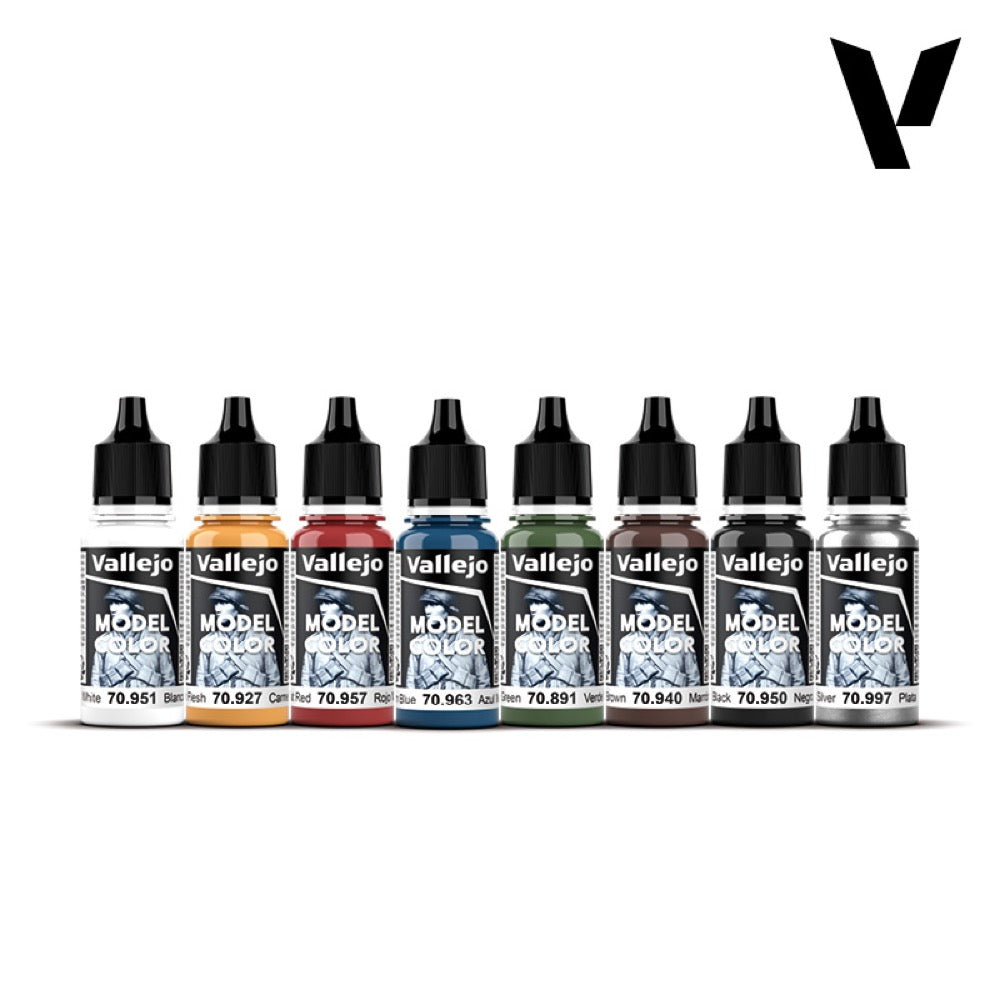 Eight Vallejo Model Color paint bottles in various colors, with black dropper caps, lined up on a white background