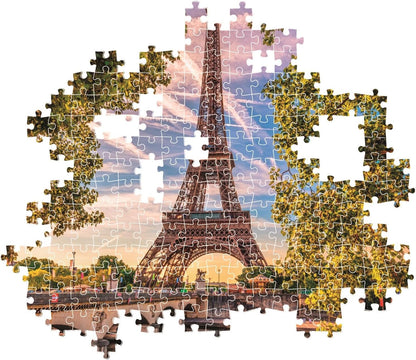 Partially assembled jigsaw puzzle of the Eiffel Tower with missing pieces.