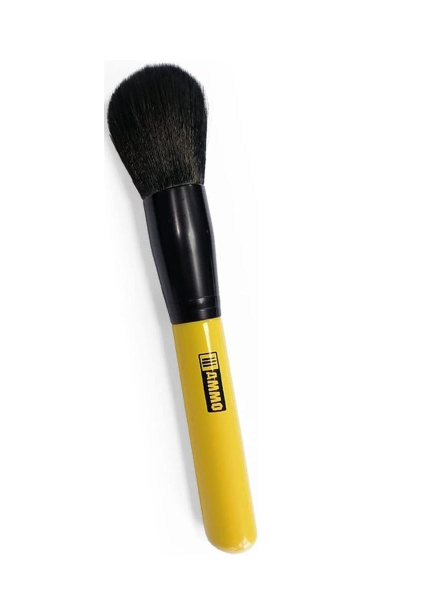 A black-bristled makeup brush with a yellow handle and 'AMMO' logo.