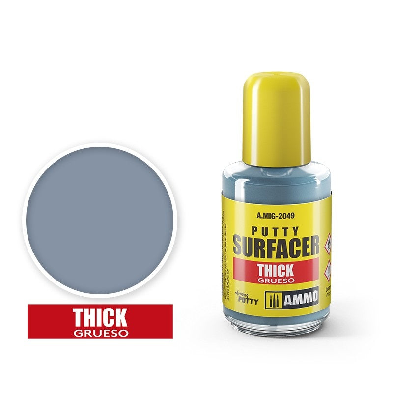 Grey-blue AMMO Putty Surfacer Thick (A.MIG-2049) bottle, with a yellow cap and matching color swatch.