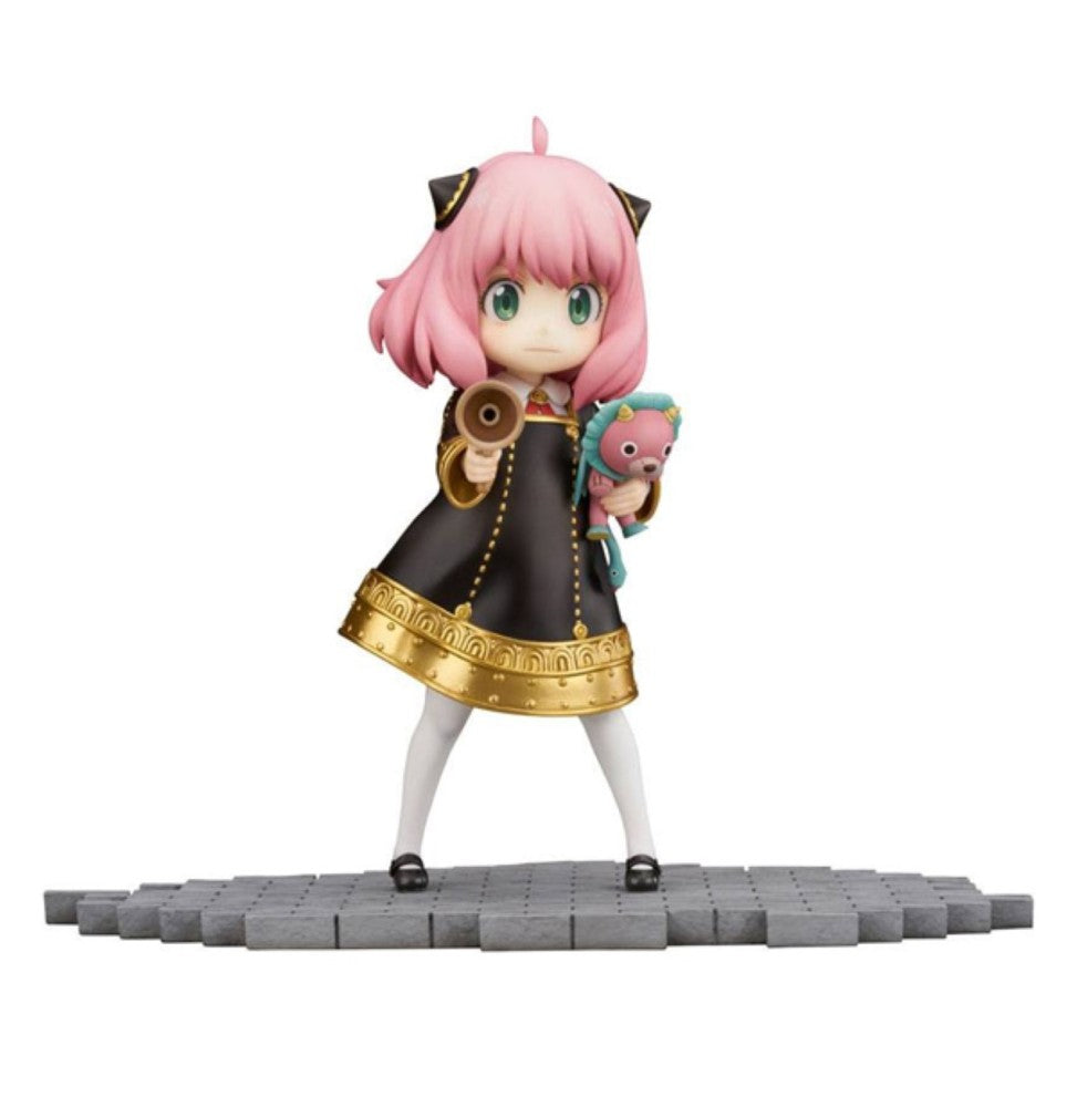 Anya Forger figure in a black dress, holding a megaphone and a pink Chimera plush