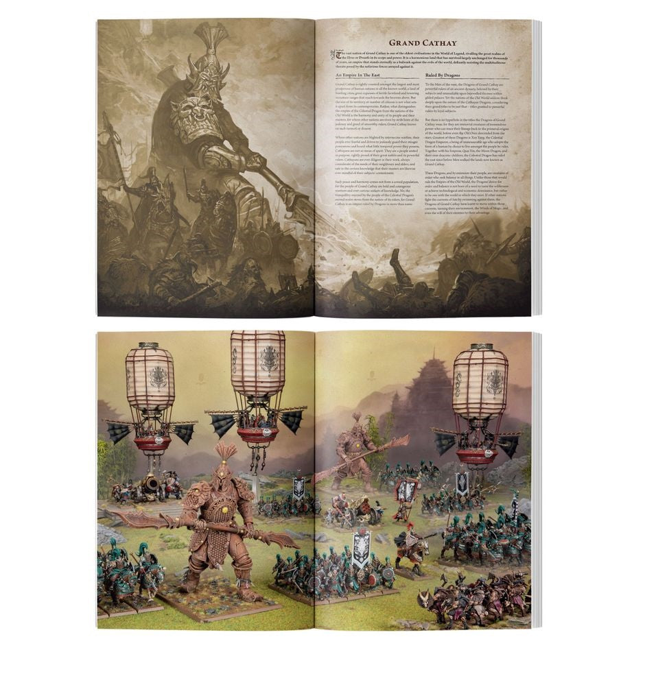 Open book displaying a sepia fantasy art battle scene with a giant warrior, and a color photo of fantasy wargame miniatures