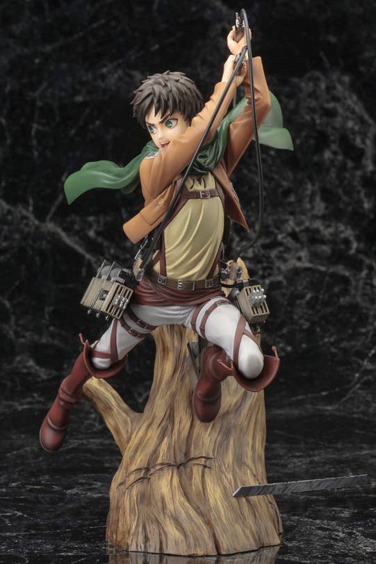 Eren Yeager anime figure launching from a tree stump, wielding dual swords and ODM gear on dark background