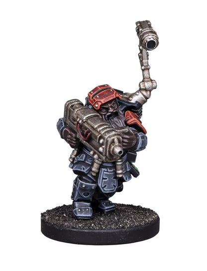 A heavily armored dwarf miniature, in black and red, holding a large futuristic weapon and a shoulder-mounted tool
