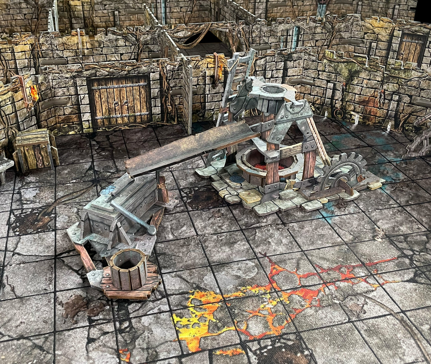 Miniature dungeon forge with glowing molten material, gears, and a chute on a gridded map