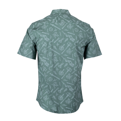 Back of a sage green short-sleeved shirt patterned with white fantasy weapons and symbols