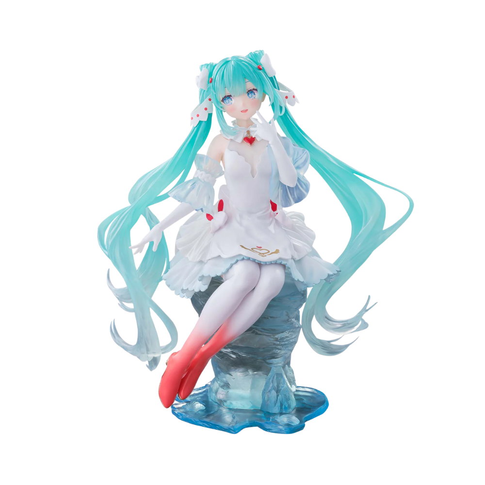 Hatsune Miku figure in a white heart dress sitting on an icy blue pedestal, with long teal twin tails