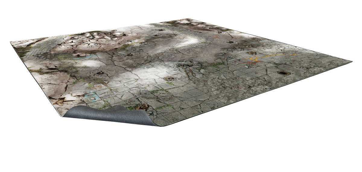 Angled battle mat showing a ruined city with cracked pavement, cobblestones, and dirt. A corner is curled up.
