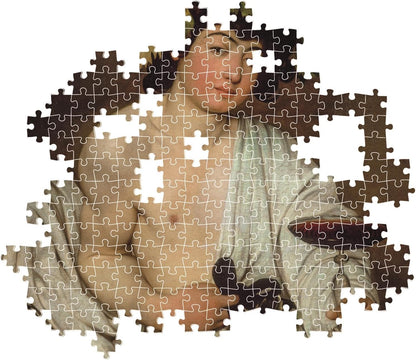 An incomplete jigsaw puzzle of a classical painting: a bare-chested man draped in fabric, looking up
