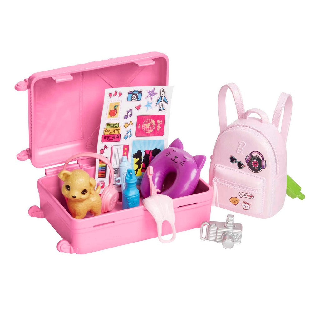 A pink Barbie travel playset with an open suitcase containing a puppy, cat pillow, stickers, plus a pink backpack and camera
