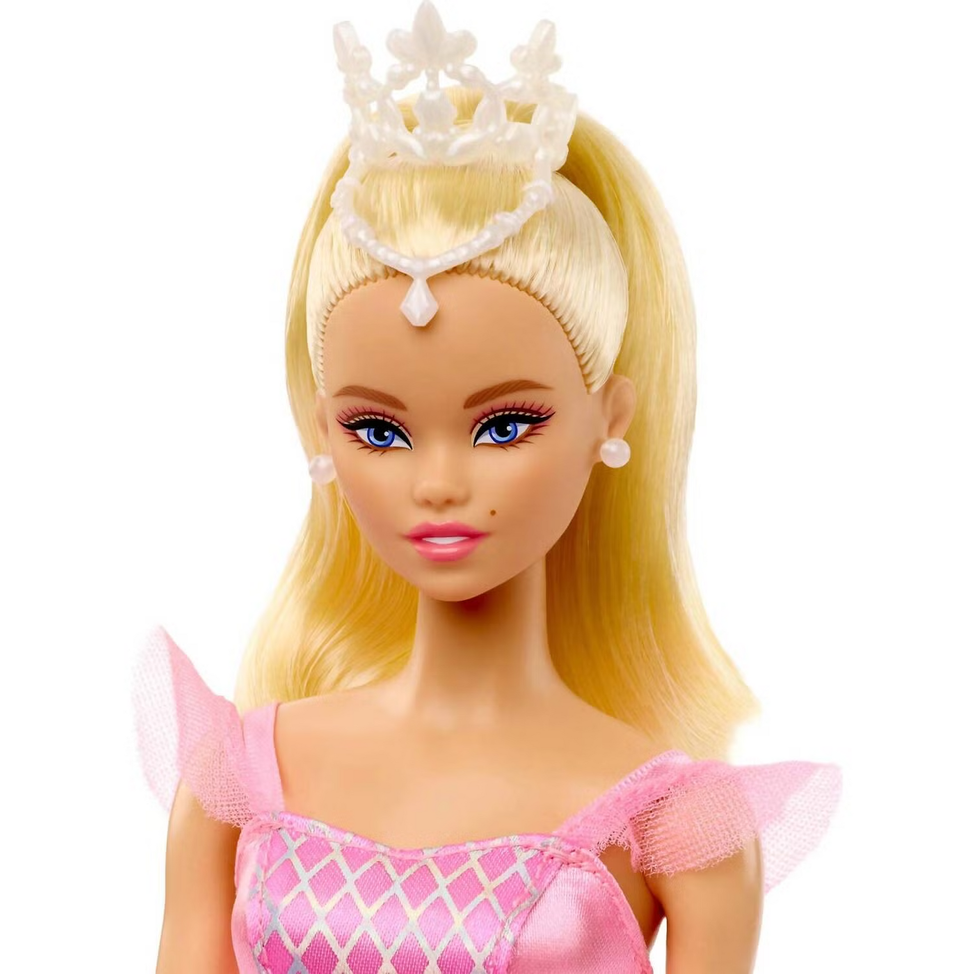 Blonde Barbie doll in a pink princess dress with a white crown and pearl earrings