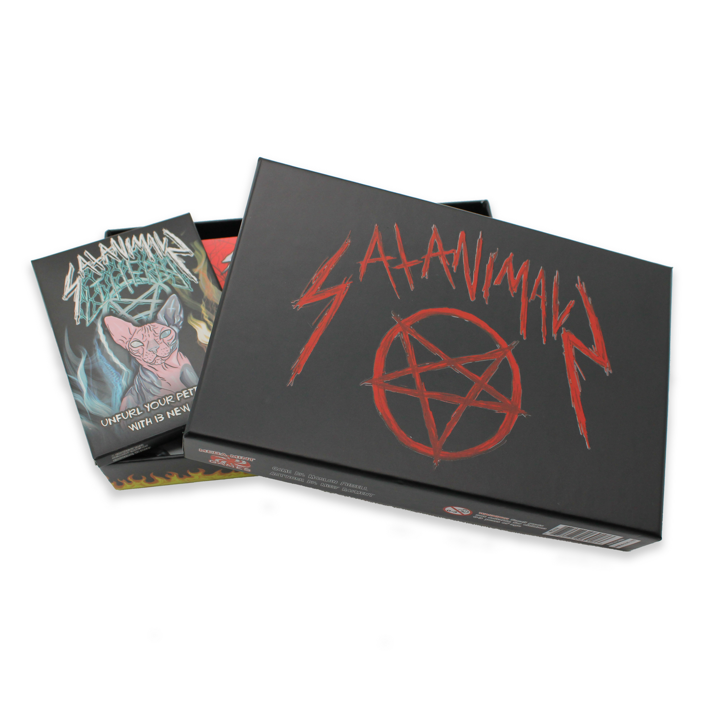 Open black "SATANIMAL" game box with a red pentagram, revealing cards including one with a pink Sphynx cat