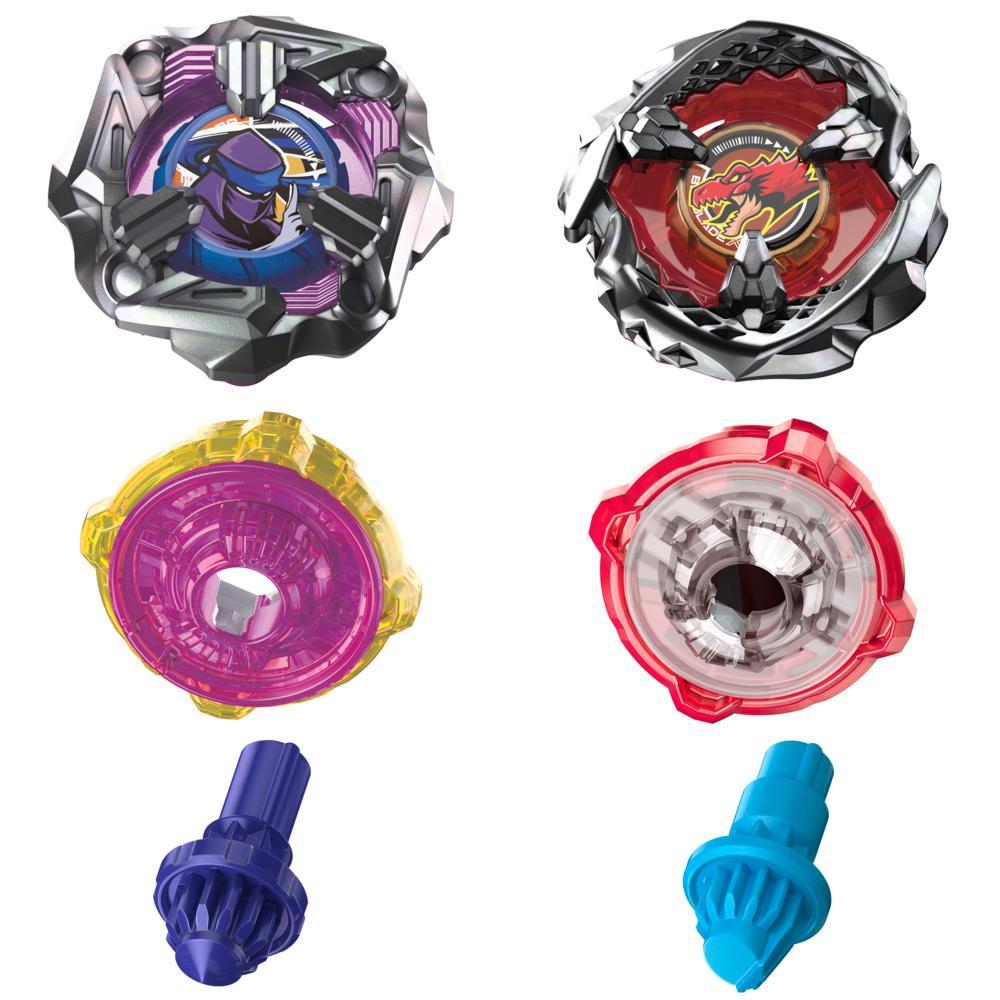 Four Beyblade spinning top toys. Two assembled tops with detailed designs, plus two sets of colored, unassembled parts