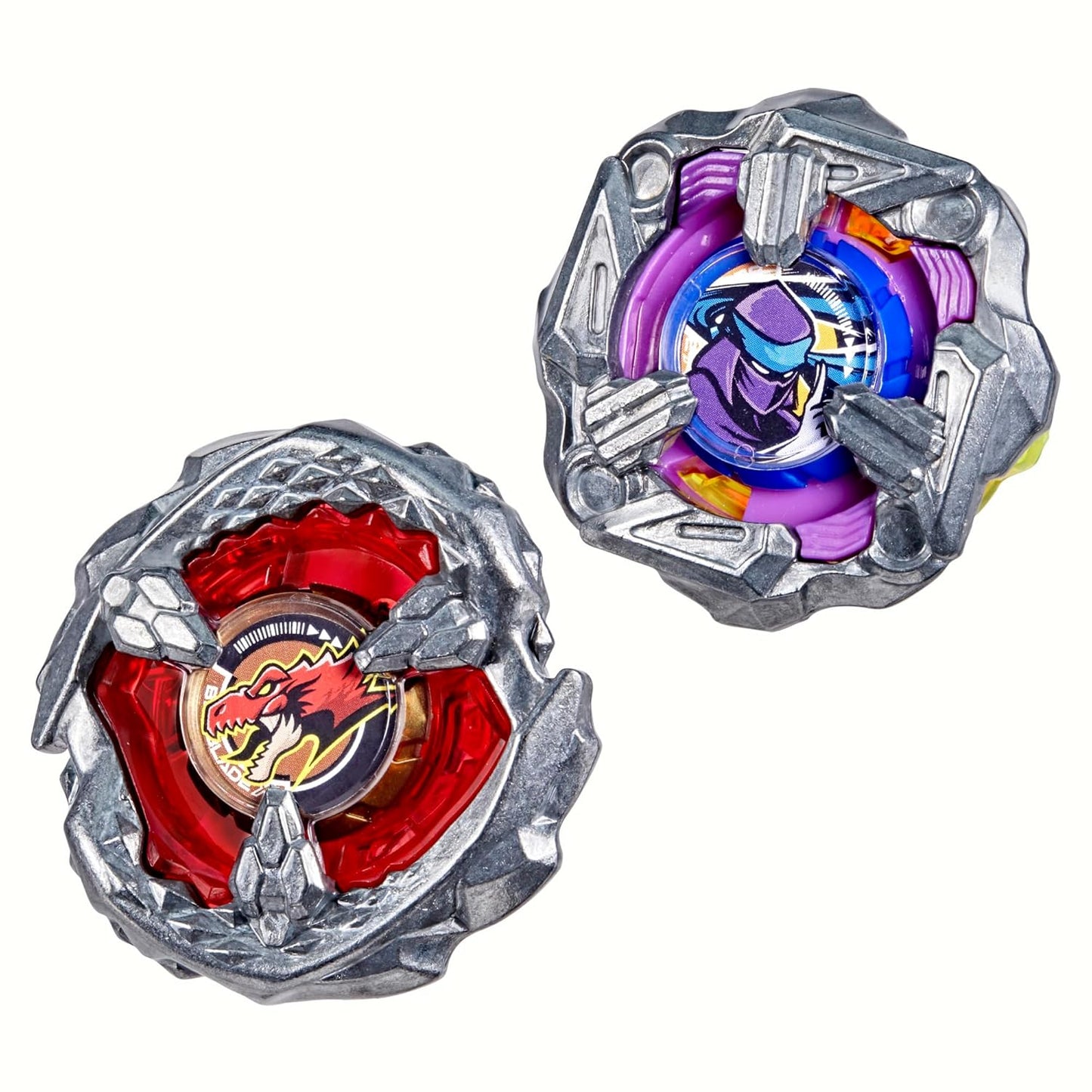 Two detailed Beyblade spinning tops: one red with a dragon, one purple with a ninja