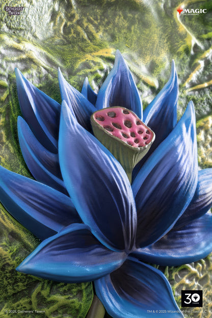 Sculpture of Magic: The Gathering's blue Black Lotus, with a pitted pink center on a textured green background